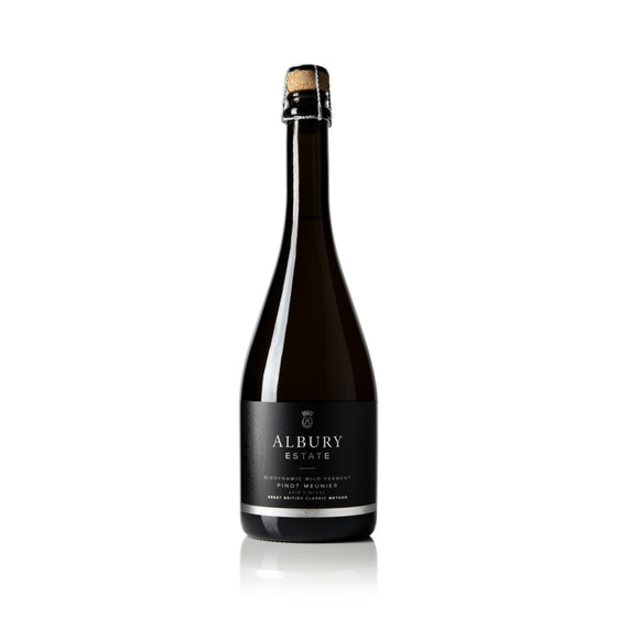 A bottle of Albury Estate Sparkling Wine, featuring a dark glass bottle with a black label and a cork seal, set against a plain white background with a subtle reflection.