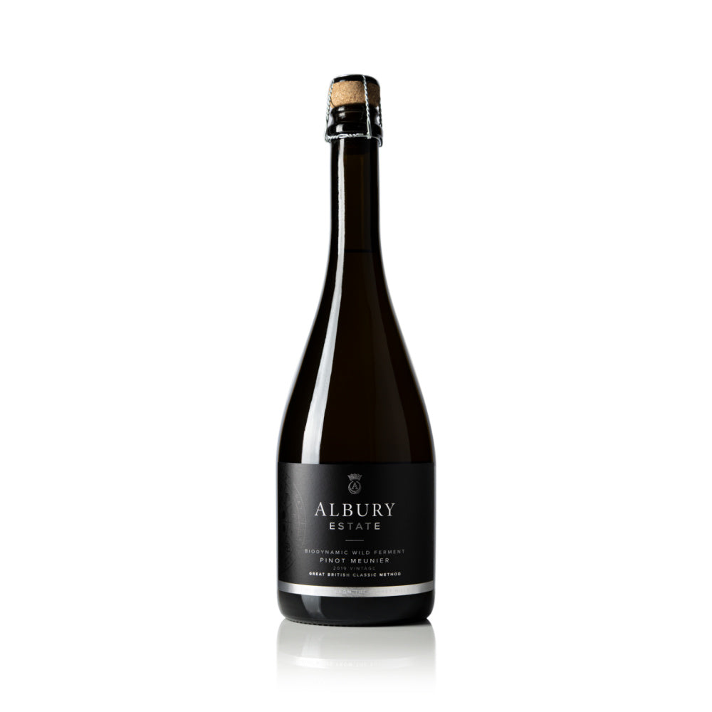 A bottle of Albury Estate Sparkling Wine, featuring a dark glass bottle with a black label and a cork seal, set against a plain white background with a subtle reflection.