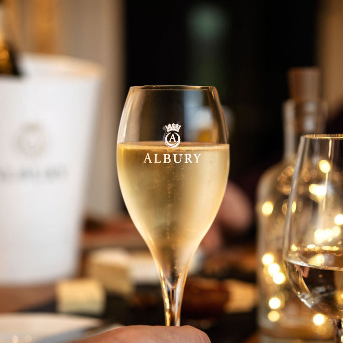Glass of Albury champagne with blurred background