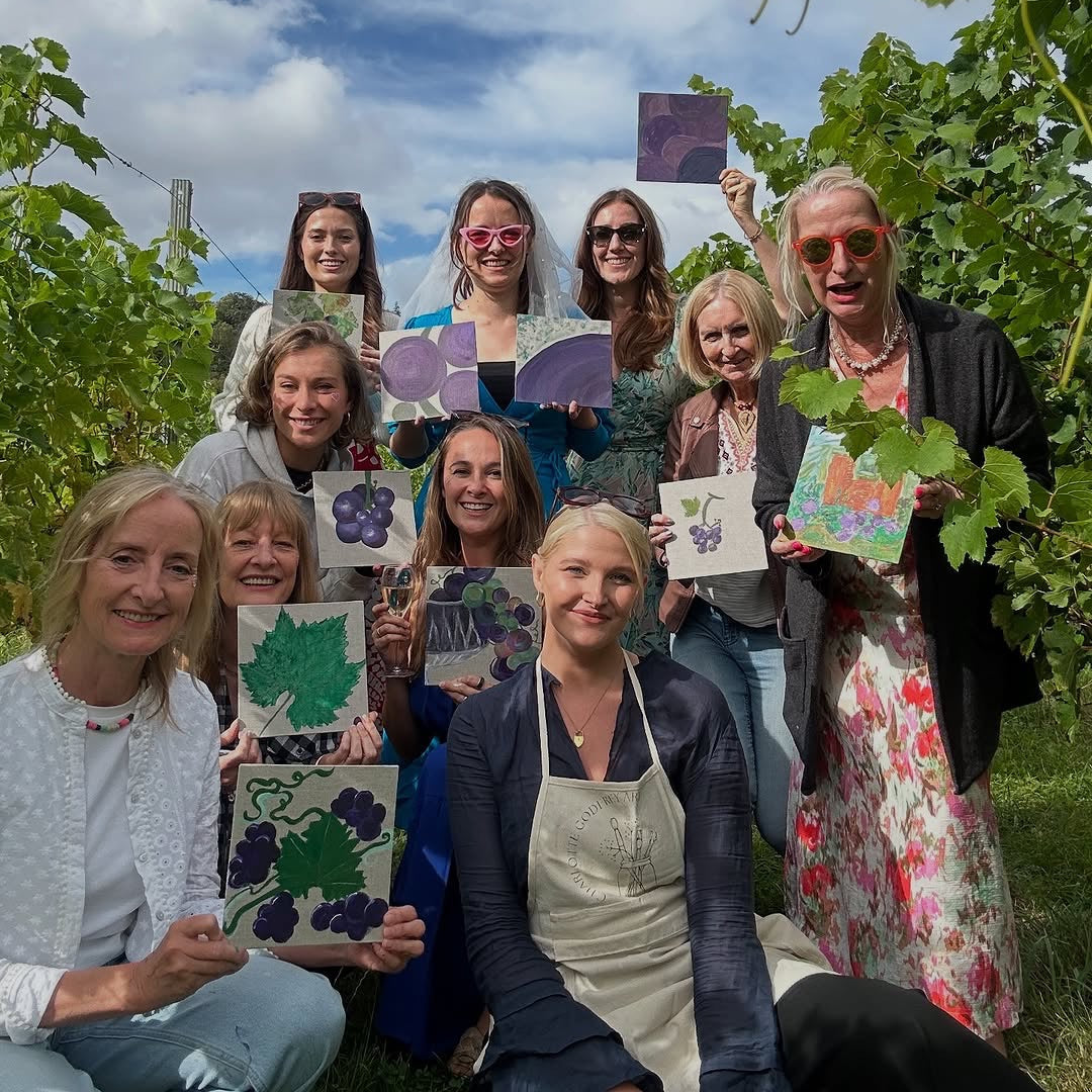 group of ladies with art in the vines at albury vineyard